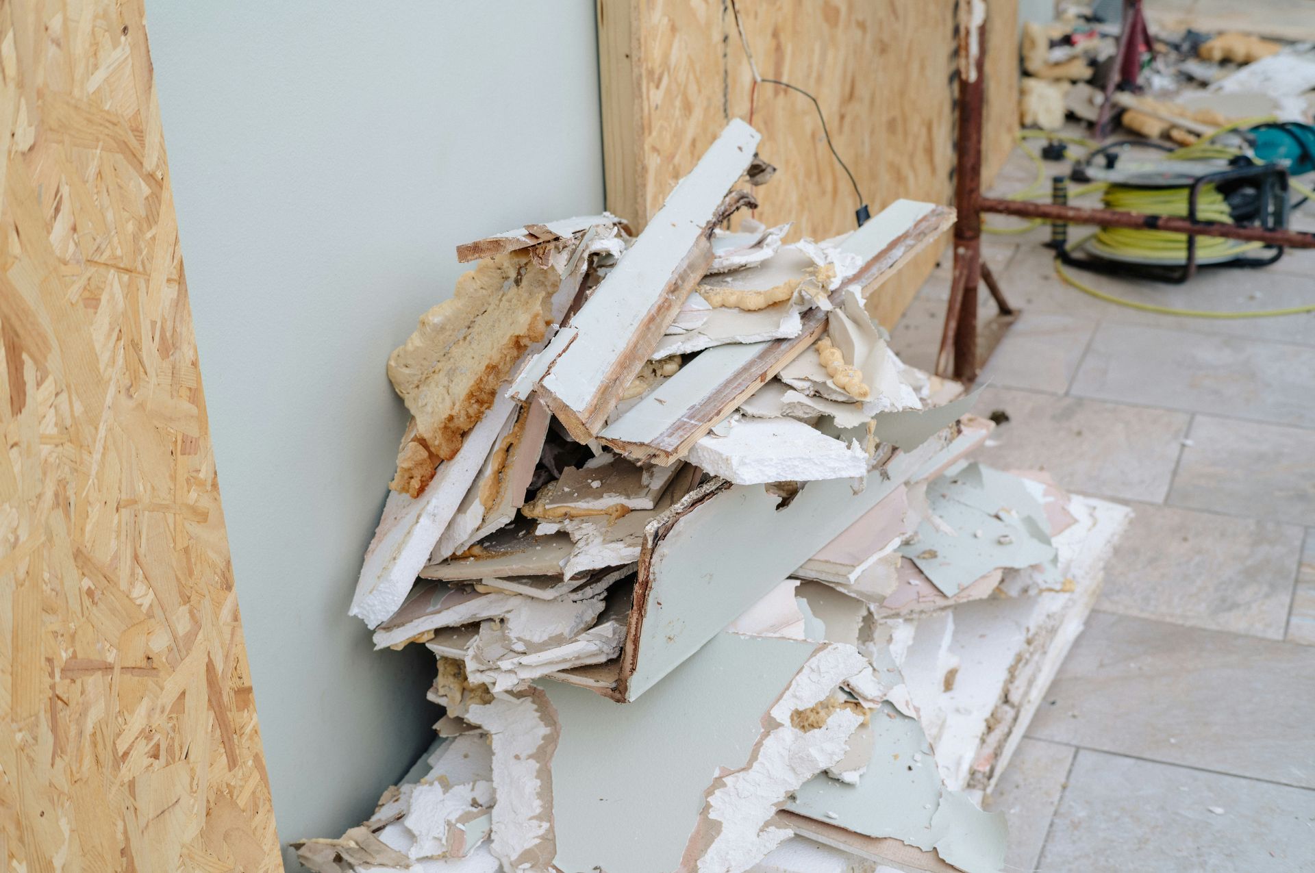 Pile of broken drywall and construction debris